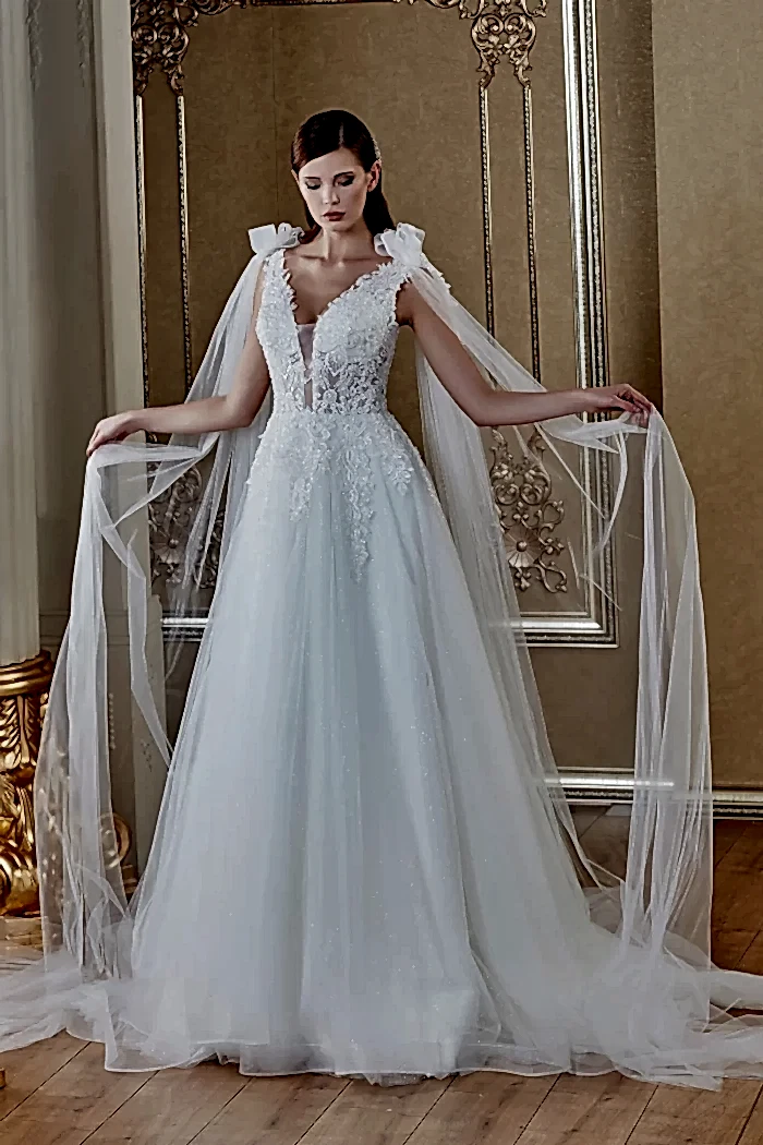 Derin V Yaka Omuz Pelerin Detaylı Transparan Helen Gelinlik Modeli